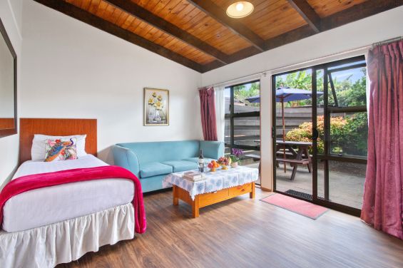 1-Bedroom Suites bed and living area